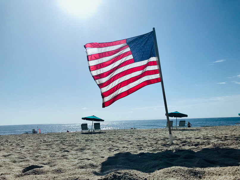close up American flag on beach