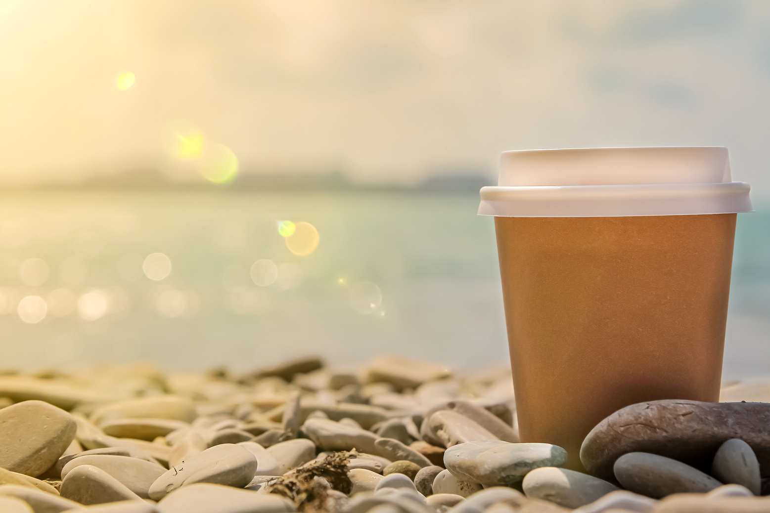 Coffee cup on the beach